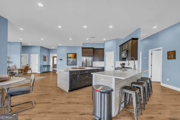 a kitchen with a sink stove and refrigerator