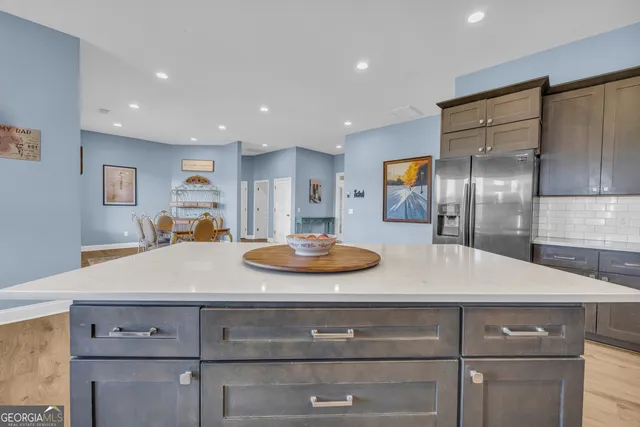 a bedroom with a bed and a dresser in it