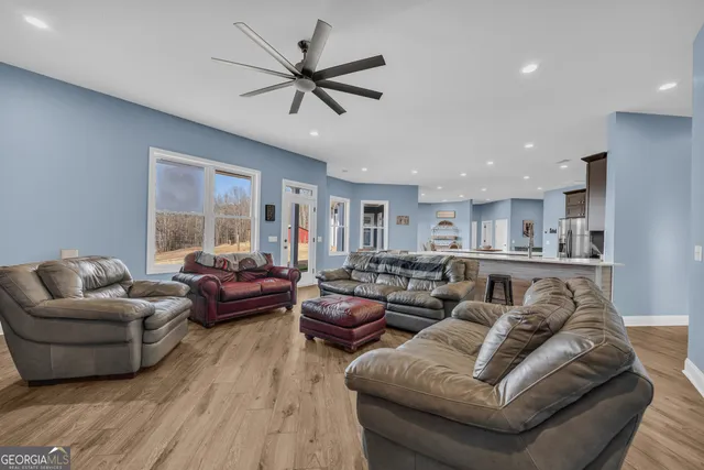 a white bath tub sitting next to a white toilet