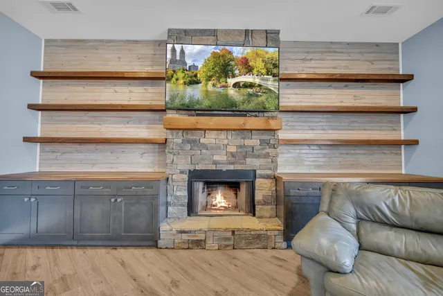 a bedroom that has a bed and a chair in it