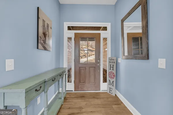 a living room with stainless steel appliances kitchen island granite countertop furniture and a kitchen view