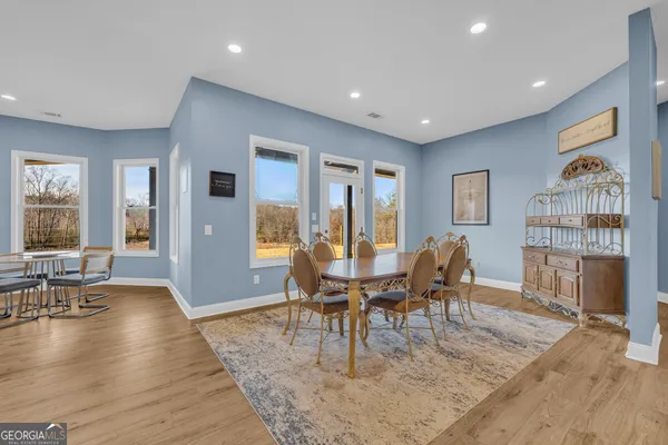 a kitchen with stainless steel appliances a sink a stove a refrigerator and cabinets