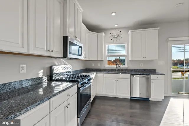 a view of a hallway with closet and stairs