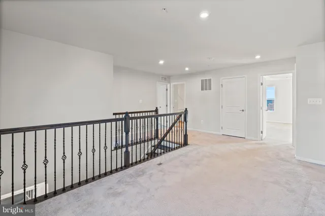 a bathroom with a sink toilet tub vanity and shower