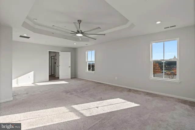 a bathroom with a shower and a glass door