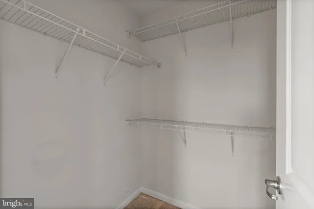 a bathroom with a glass shower door and mirror