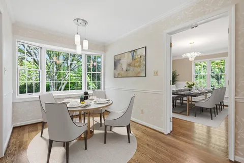 a dining room with furniture window wooden floor