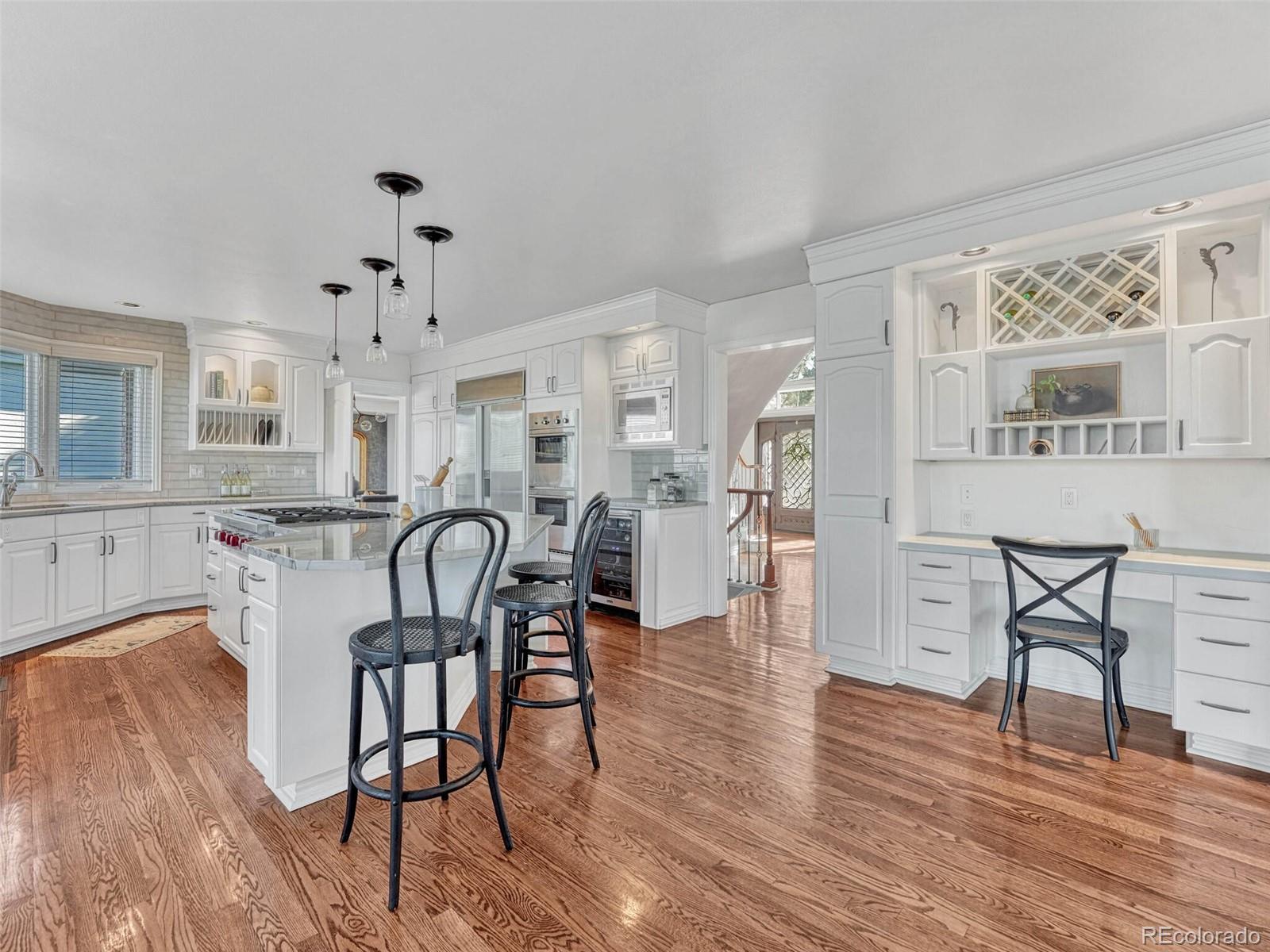 8541 Colonial Drive Lone Tree, CO 80124 - Photo 11 of 45 a dining room with furniture and wooden floor