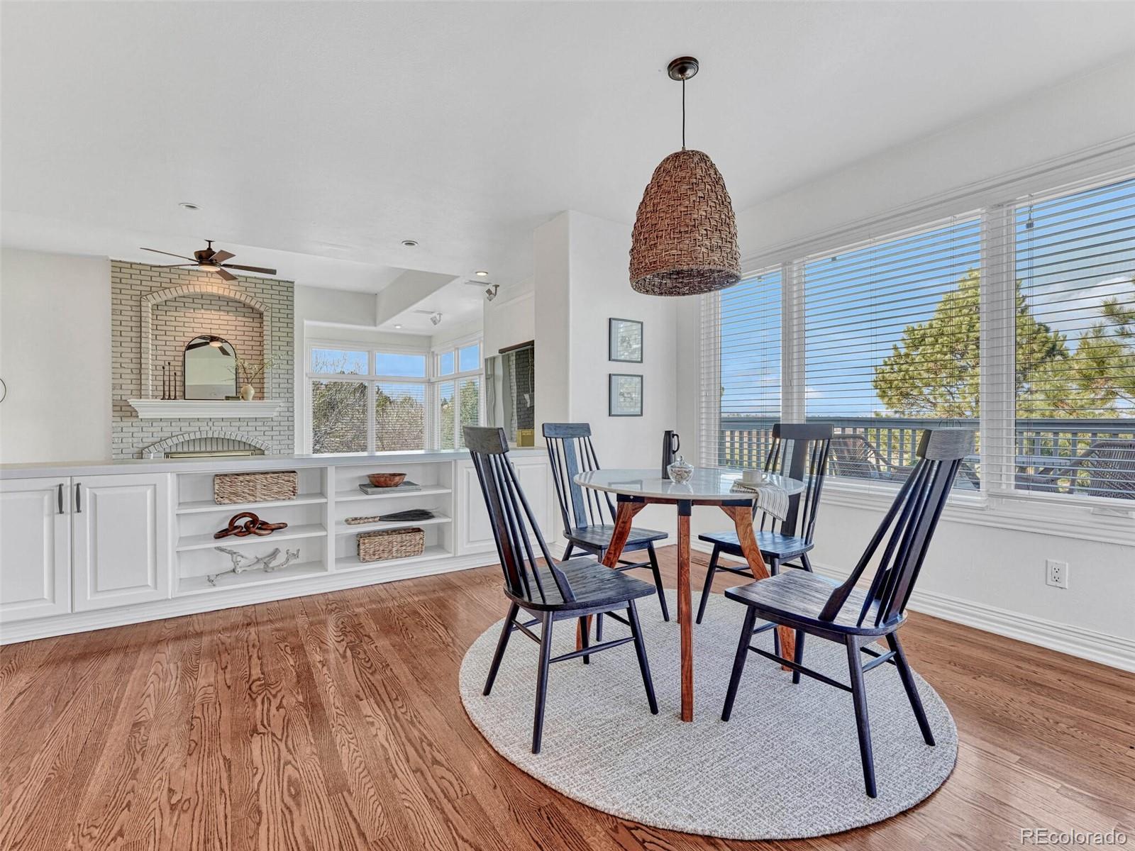 8541 Colonial Drive Lone Tree, CO 80124 - Photo 15 of 45 a dining room with furniture and wooden floor