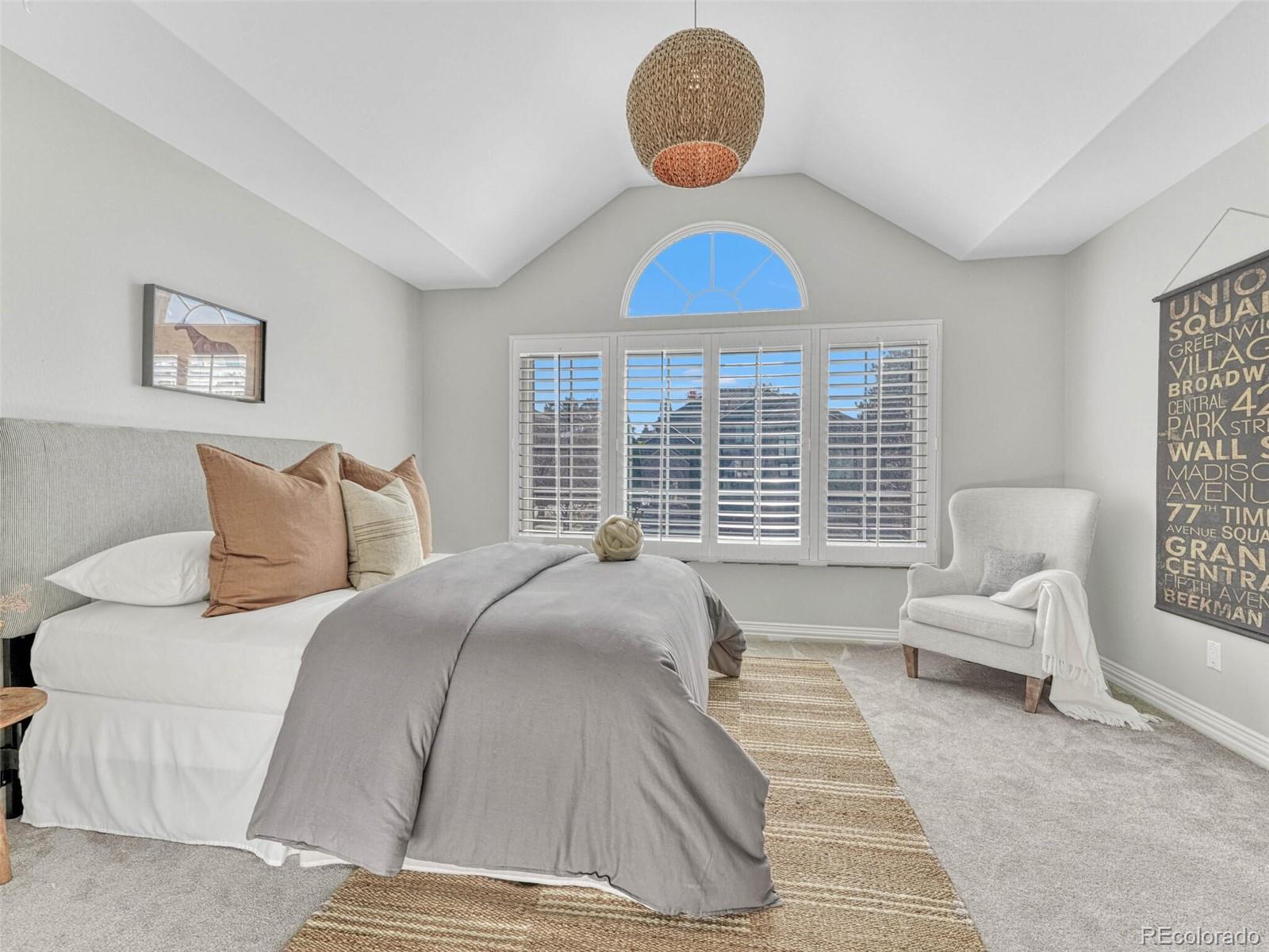 8541 Colonial Drive Lone Tree, CO 80124 - Photo 24 of 45 a bedroom with a bed and a large window