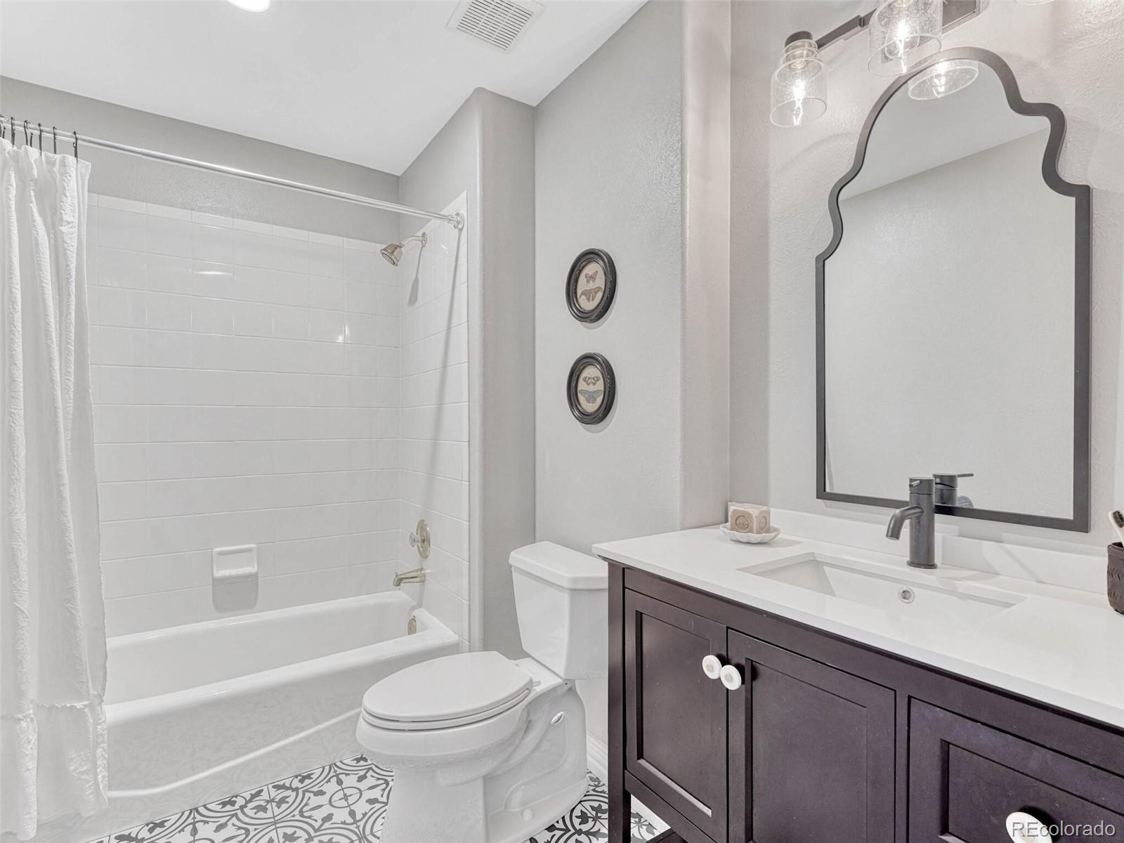 8541 Colonial Drive Lone Tree, CO 80124 - Photo 29 of 45 a bathroom with a sink a toilet and a bathtub