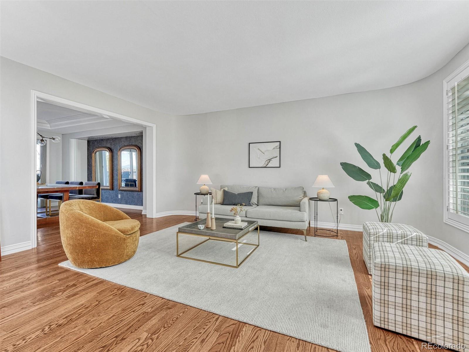 8541 Colonial Drive Lone Tree, CO 80124 - Photo 3 of 45 a living room with furniture and wooden floor