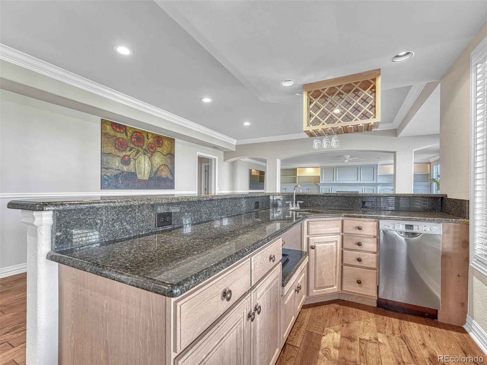 8541 Colonial Drive Lone Tree, CO 80124 - Photo 32 of 45 a kitchen with stainless steel appliances granite countertop a sink and cabinets
