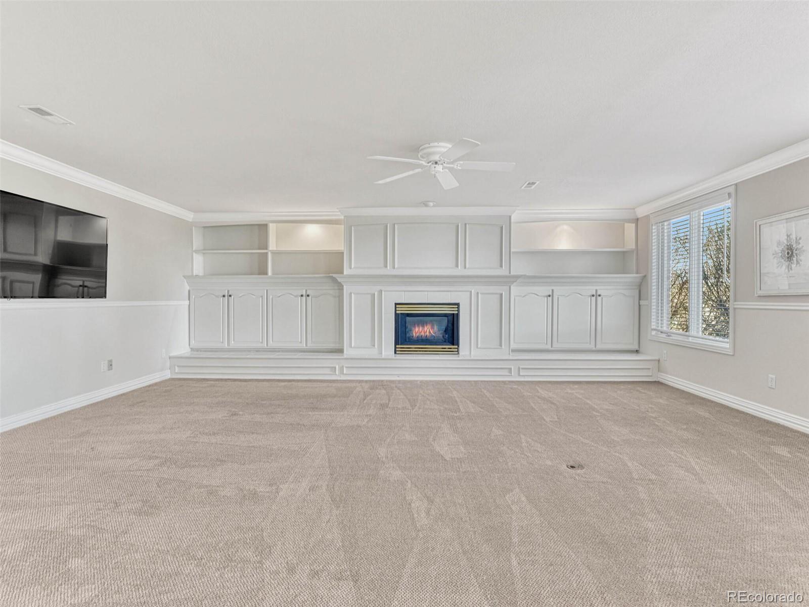 8541 Colonial Drive Lone Tree, CO 80124 - Photo 33 of 45 a view of an empty room with a kitchen
