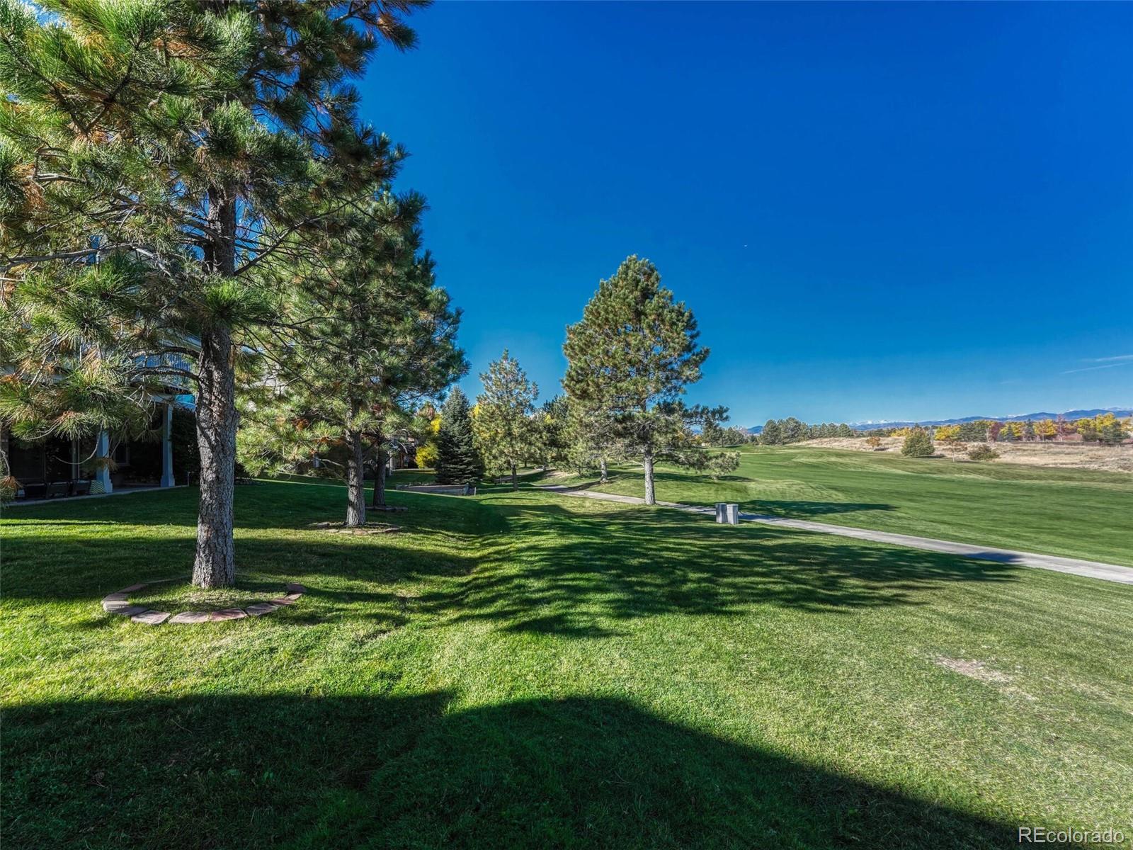 8541 Colonial Drive Lone Tree, CO 80124 - Photo 39 of 45 a view of a golf course with a garden