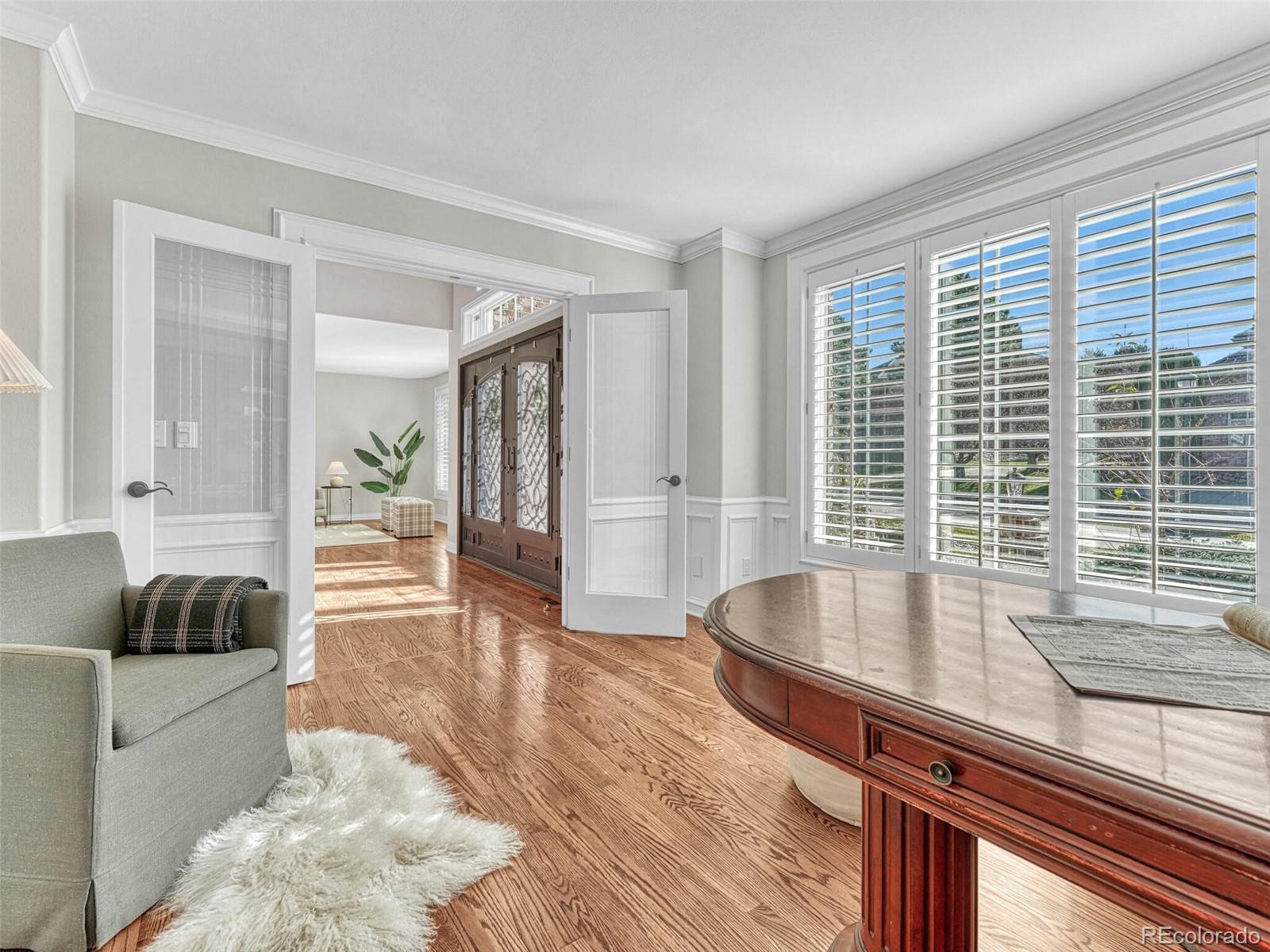 8541 Colonial Drive Lone Tree, CO 80124 - Photo 6 of 45 a living room with furniture and a large window