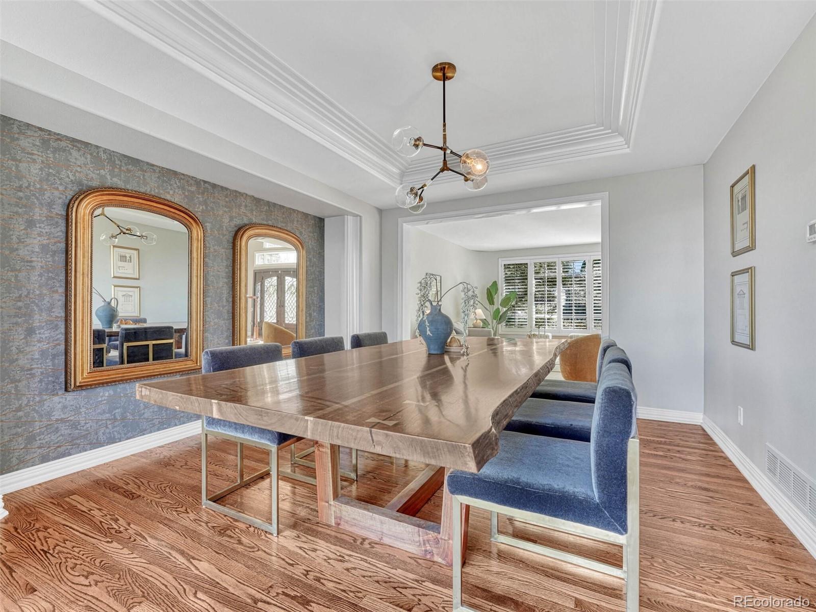 8541 Colonial Drive Lone Tree, CO 80124 - Photo 8 of 45 a view of dining room and hall with wooden floor