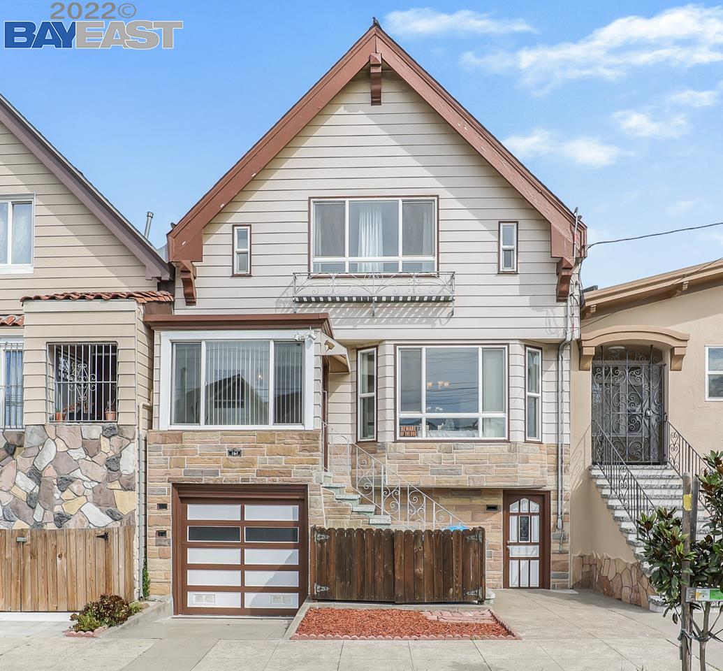 157 Rolph Street San Francisco, CA 94112 - Photo 1 of 1 a front view of a house with a balcony