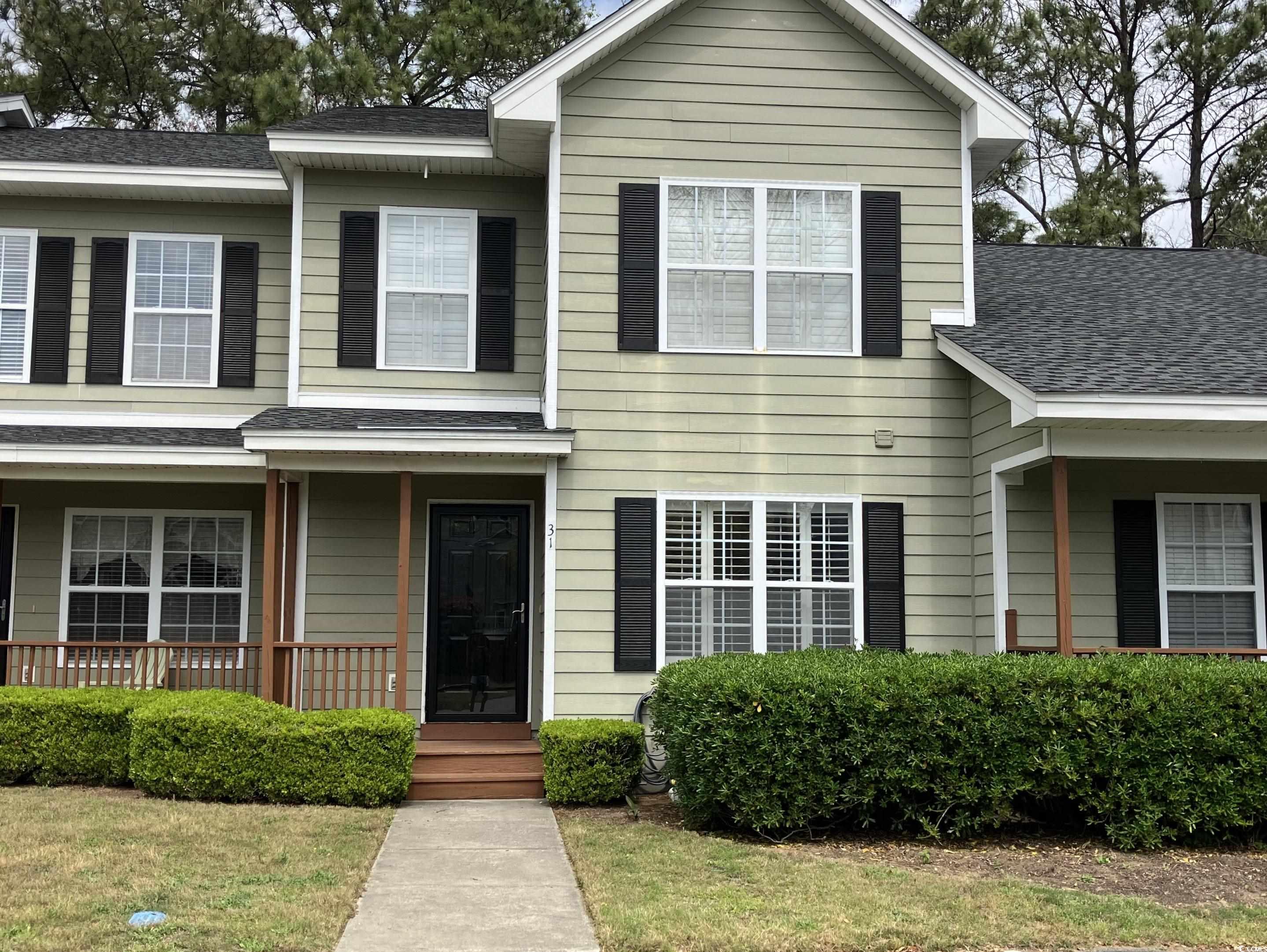 4840 Moss Creek Loop, Unit 31 Murrells Inlet, SC 29576 - Photo 1 of 24 View of front of house with roof with shingles and a porch