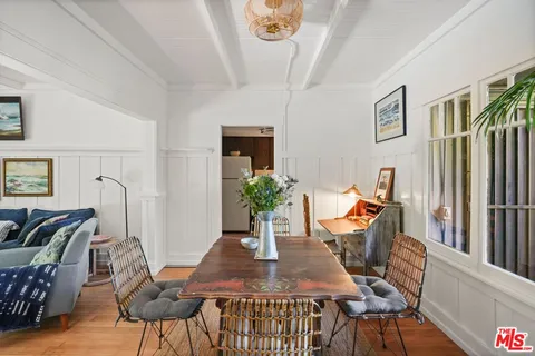 a kitchen with a sink a stove and cabinets