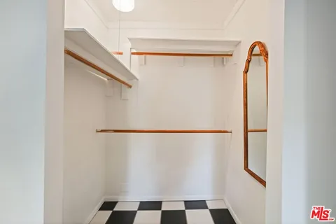 an aerial view of a house with garden space and street view