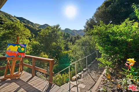 a view of a balcony with outdoor seating