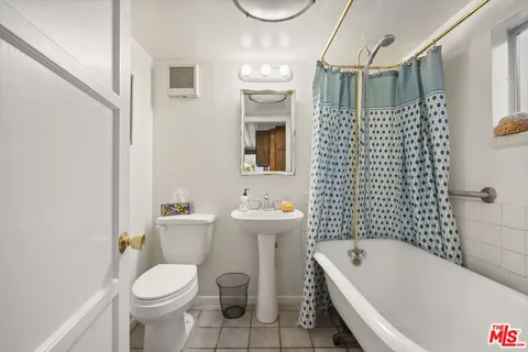 a roof deck with a table and chairs