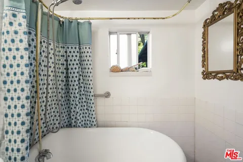 a view of a two chairs in the balcony