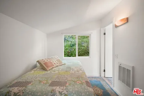 a view of a chairs and table in the balcony
