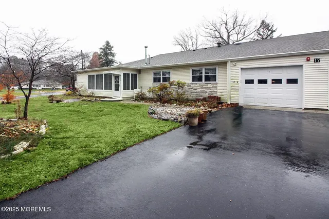 a view of a house with backyard sitting area and garden