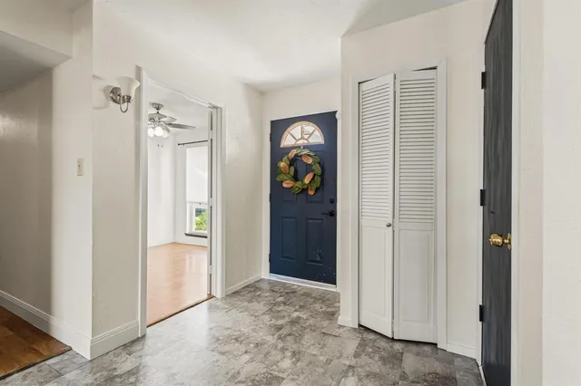a view of an entryway with wooden floor