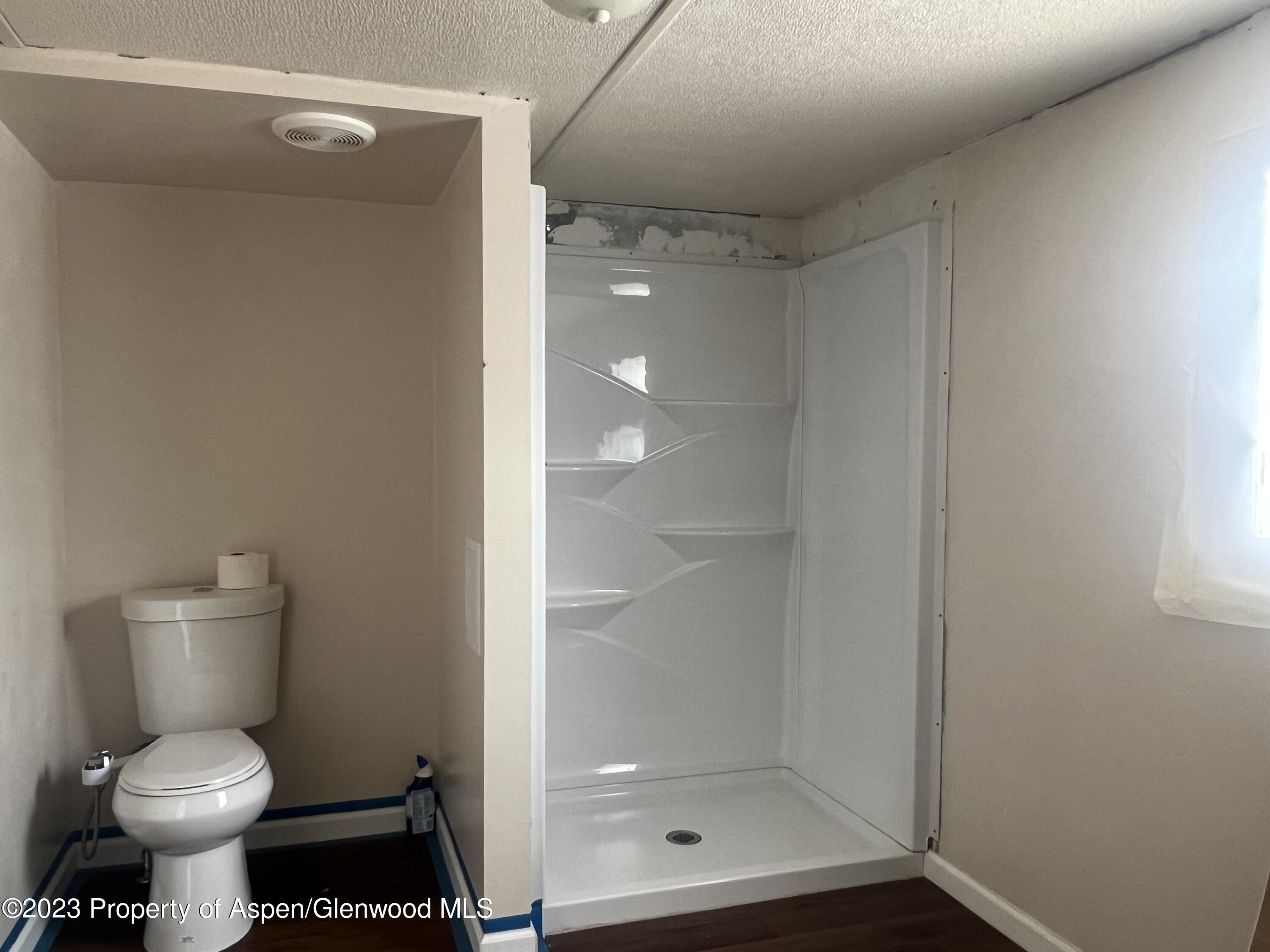 346 Greig Avenue De Beque, CO 81630 - Photo 11 of 15 a bathroom with a shower and toilet