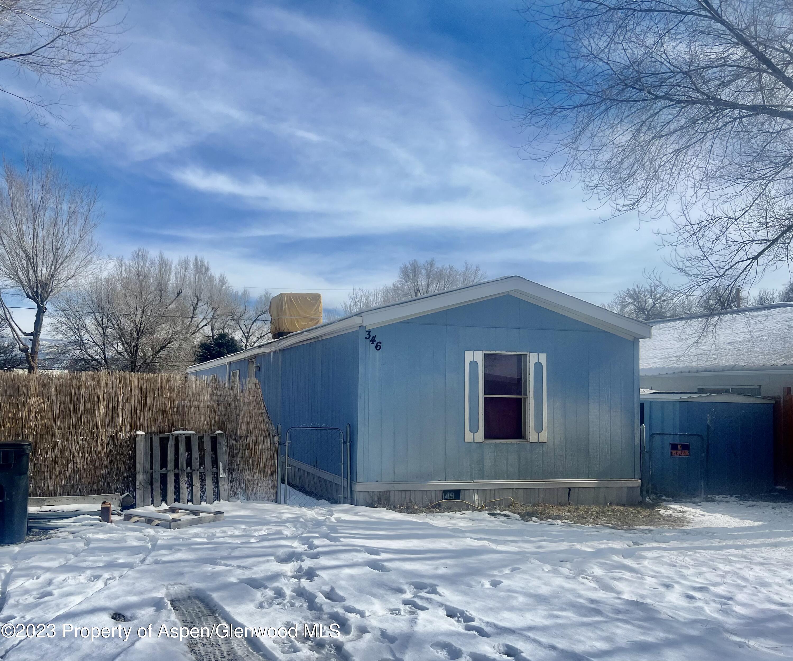 346 Greig Avenue De Beque, CO 81630 - Photo 2 of 15 a view of a house with a backyard