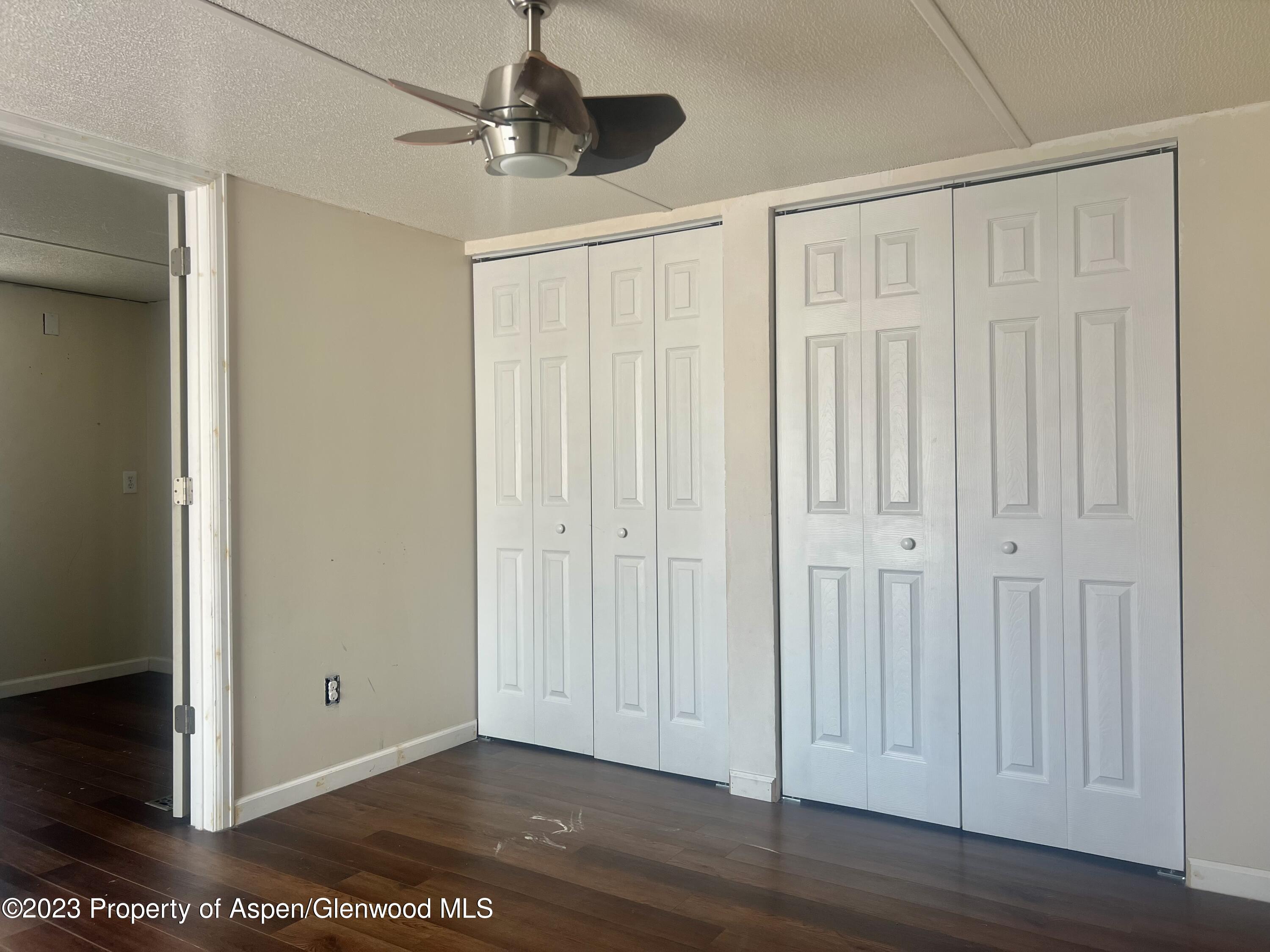 346 Greig Avenue De Beque, CO 81630 - Photo 9 of 15 a view of a room with wooden floor