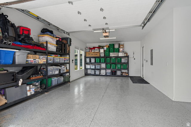 2278 Tawny Ridge Circle St. George, UT 84790 - Photo 47 of 61 Spacious garage with light gray speckled epoxy flooring.