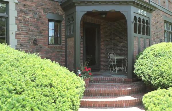 458 Chestnut Street Newton, MA 02468 - Photo 2 of 17 a front view of a house with garden