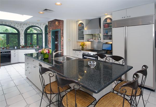 458 Chestnut Street Newton, MA 02468 - Photo 8 of 17 a kitchen with stainless steel appliances granite countertop a sink a stove and a refrigerator