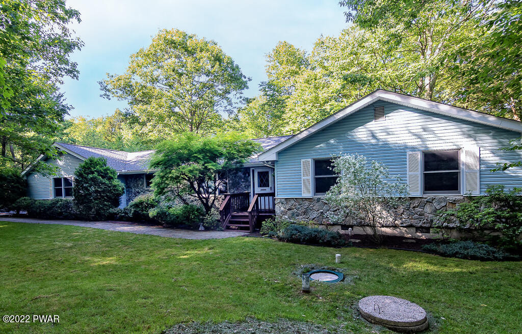 166 Devils Hole Road Cresco, PA 18326 - Photo 1 of 46 a backyard of a house with lots of green space