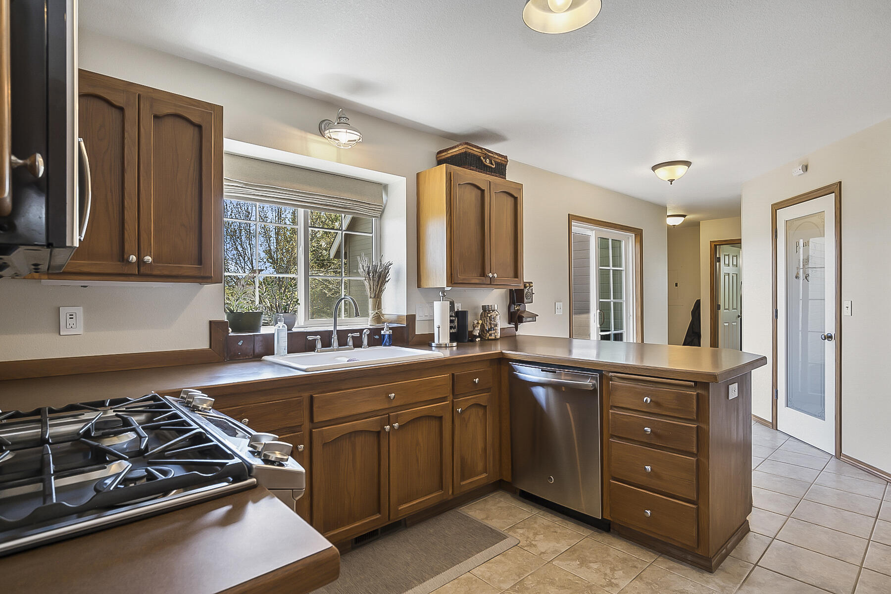 61030 Jennings Road Bend, OR 97702 - Photo 18 of 76 a kitchen with a sink a stove and cabinets
