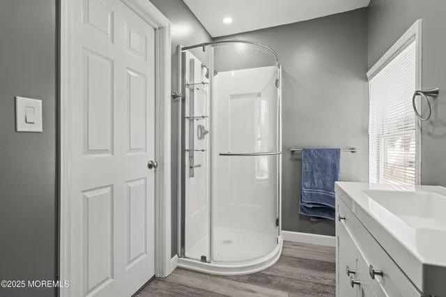 a bathroom with a tub and a sink