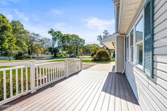 a view of a balcony with wooden floor