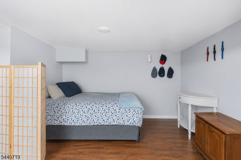 136 Smith Street Elizabeth, NJ 07201 - Photo 33 of 38 a bedroom with a bed and a window