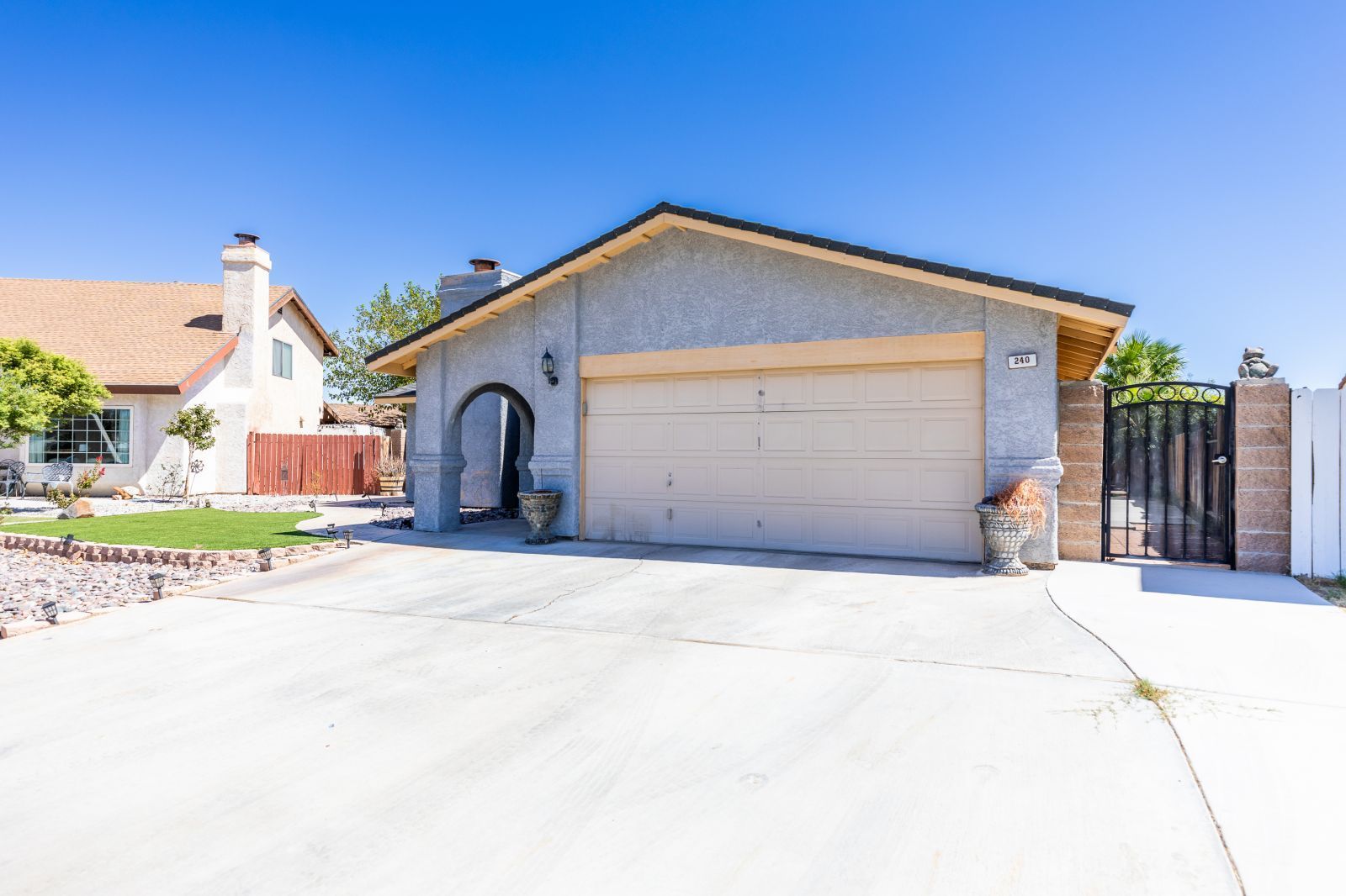 240 Richard Court Ridgecrest, CA 93555 - Photo 3 of 34 a front view of a house with a garage