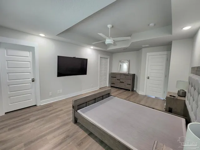 a room with a bed and a flat screen tv