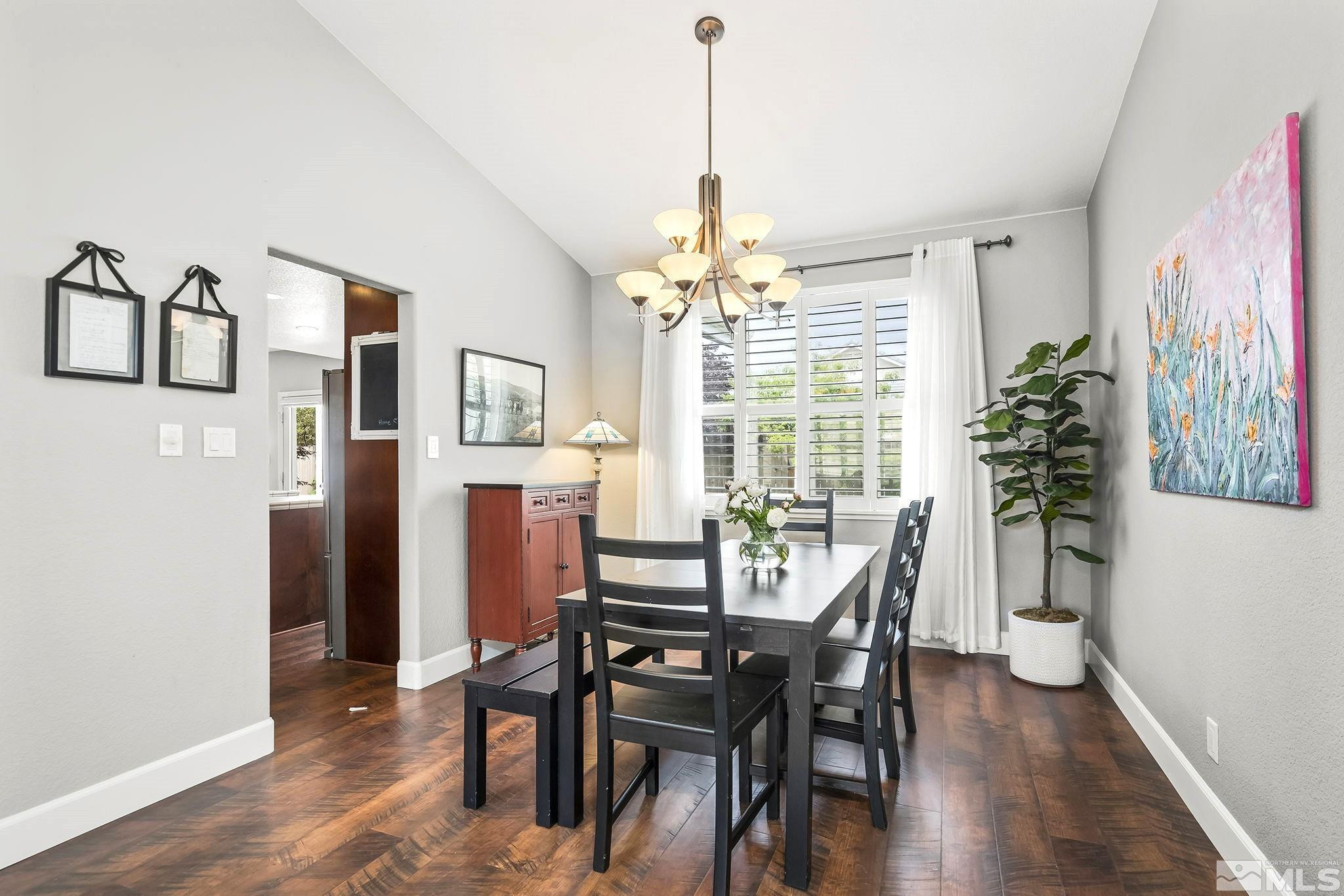 10031 Cascade Falls Drive Reno, NV 89521 - Photo 12 of 30 a view of a dining room with furniture window and wooden floor