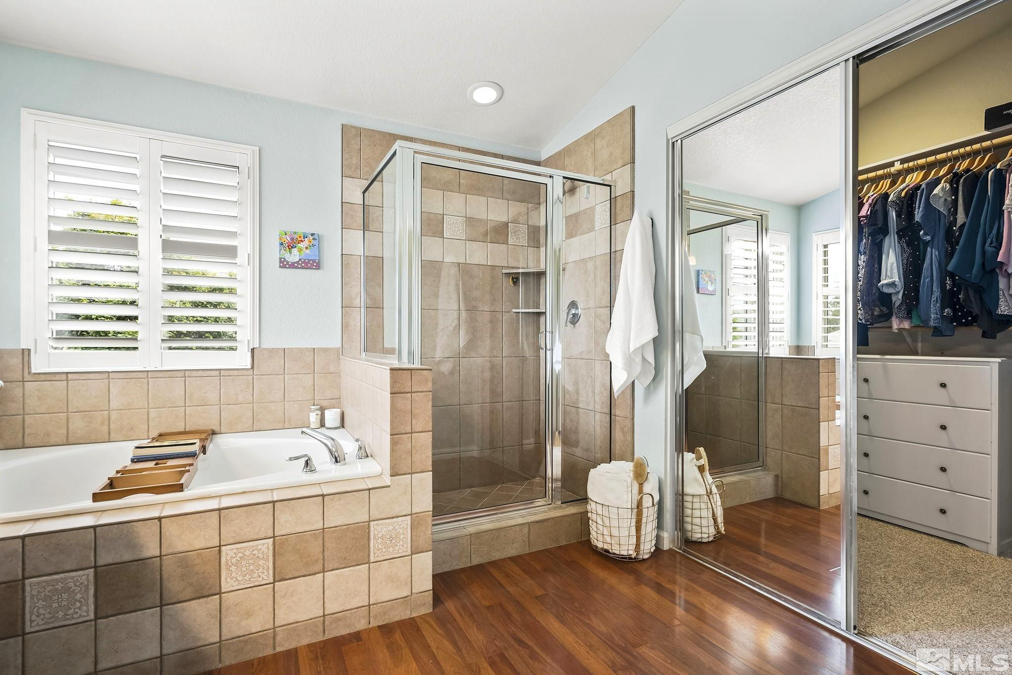 10031 Cascade Falls Drive Reno, NV 89521 - Photo 16 of 30 a spacious bathroom with a tub sink and shower