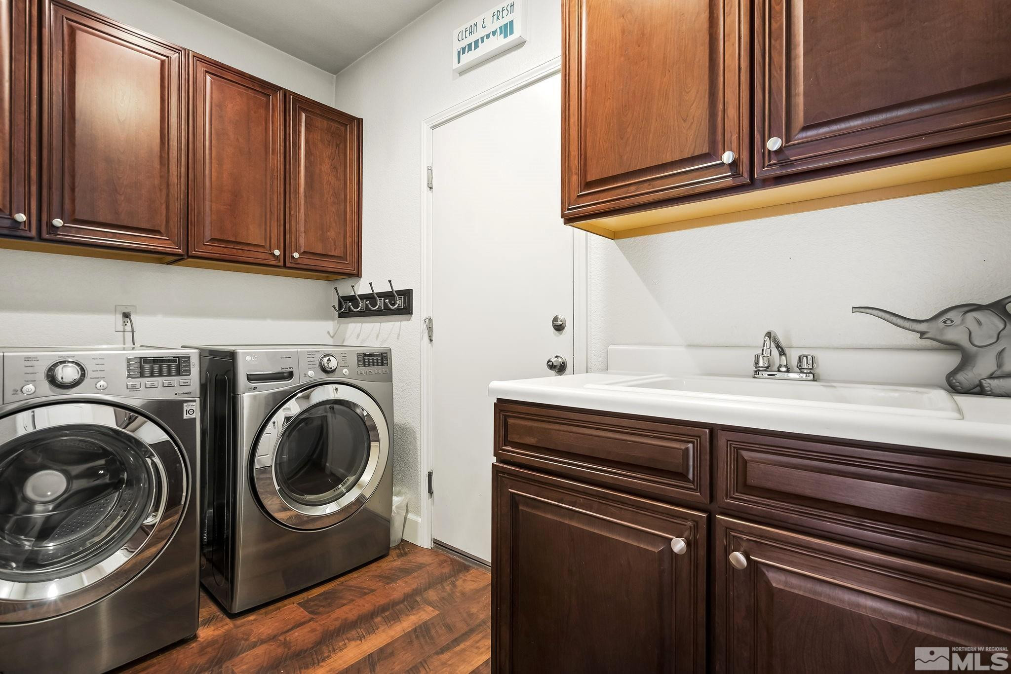 10031 Cascade Falls Drive Reno, NV 89521 - Photo 23 of 30 a utility room with sink dryer and washer