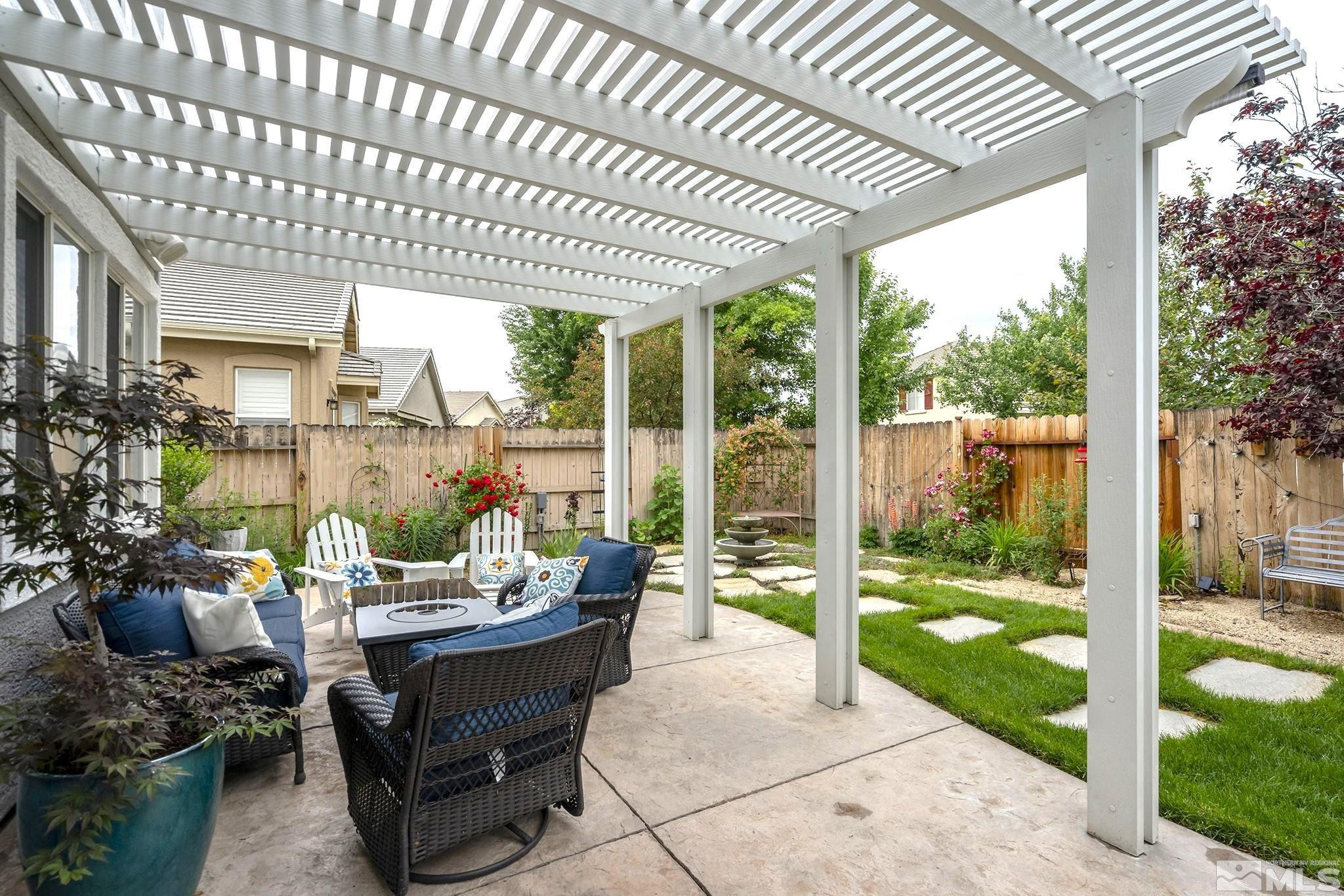 10031 Cascade Falls Drive Reno, NV 89521 - Photo 26 of 30 a outdoor living space with furniture and garden view