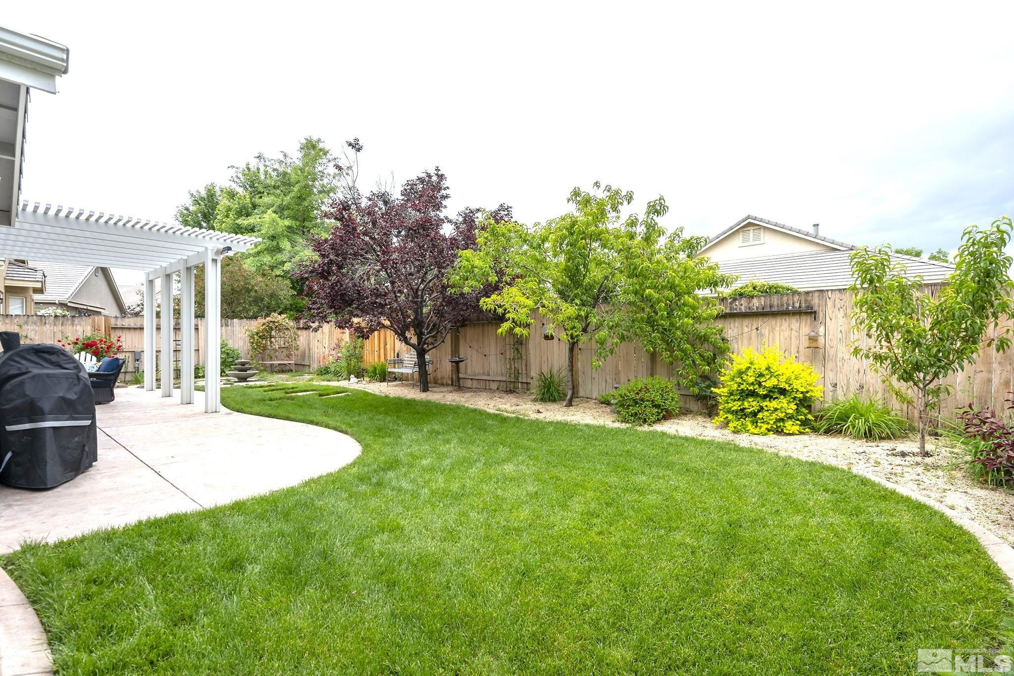 10031 Cascade Falls Drive Reno, NV 89521 - Photo 29 of 30 a view of a house with a yard and sitting area