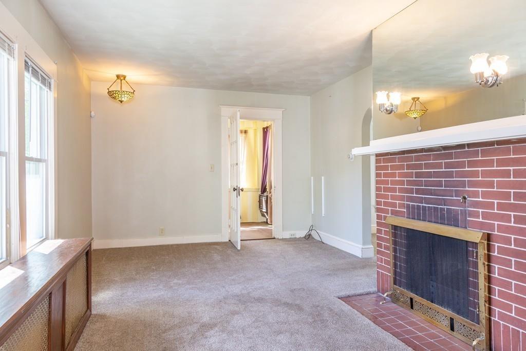 116 Jenness Street Springfield, MA 01104 - Photo 15 of 42 a view of an empty room and fire place